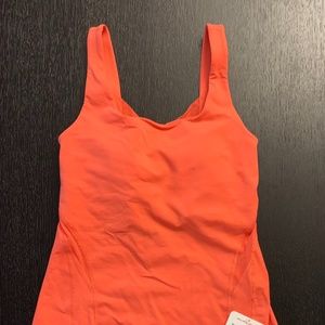 NWT Lululemon orange Rise & Flow tank Size 4